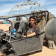 Spud sits in one of the vehicles he designed, a go-kart with a functioning jet engine attached to the back.